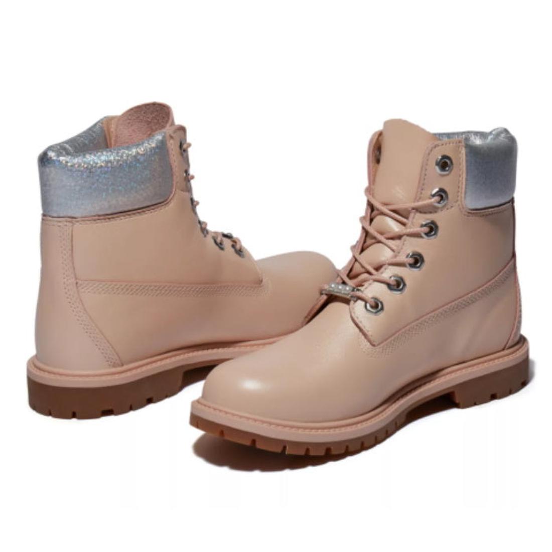 Timberland Heritage 6 Inch Waterproof Boots in light pink nubuck with sturdy brown soles, silver padded collars, and lace-up closure.  ksnz
