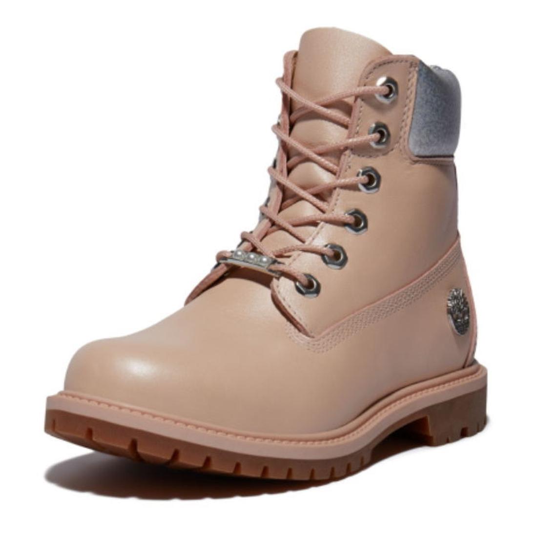 Timberland Heritage 6 Inch Waterproof Boot in light pink nubuck, with sturdy laces, cozy gray collar, and grippy brown sole.  ksnz