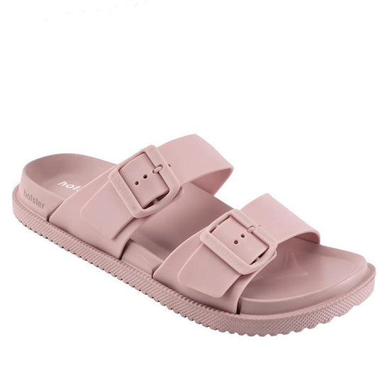 Introducing the Holster Soleseeker Rose Pink Summer Women’s Slide—a light pink sandal featuring two wide buckle straps and a textured sole. Designed for casual wear, these supportive slides deliver both comfort and style.