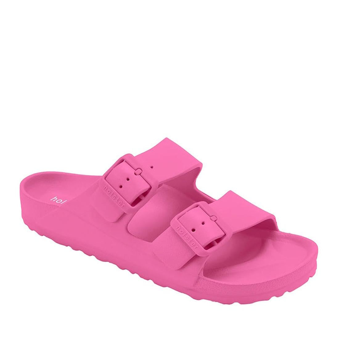 The Holster Sundreamer Women’s Slide Sandal in hot pink features two wide straps with large adjustable buckles, a textured sole, and a contoured footbed designed for enhanced arch support.