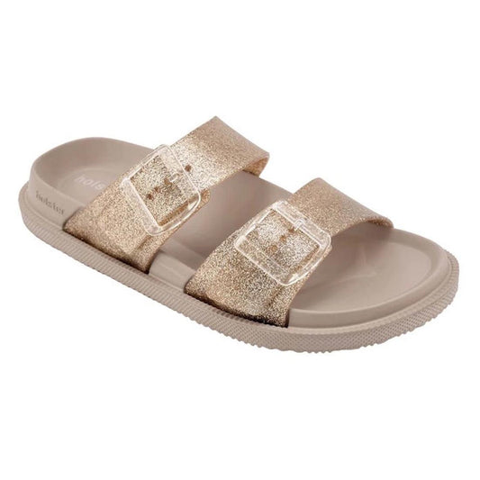 Introducing the Holster Womens Soleshimmer Gold Glitter Summer Slide: a beige vegan sandal featuring two wide, glittery gold straps with clear buckles, a textured sole for added grip, an open toe design, and comfortable arch support.