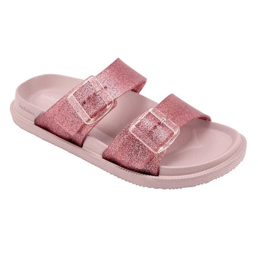 Introducing the Holster Womens Soleshimmer Pink Glitter Summer Slide: these vegan sandals feature a playful pink glitter finish, two thick straps with clear buckles, and a textured sole for added grip—blending eye-catching style and comfort you can feel g