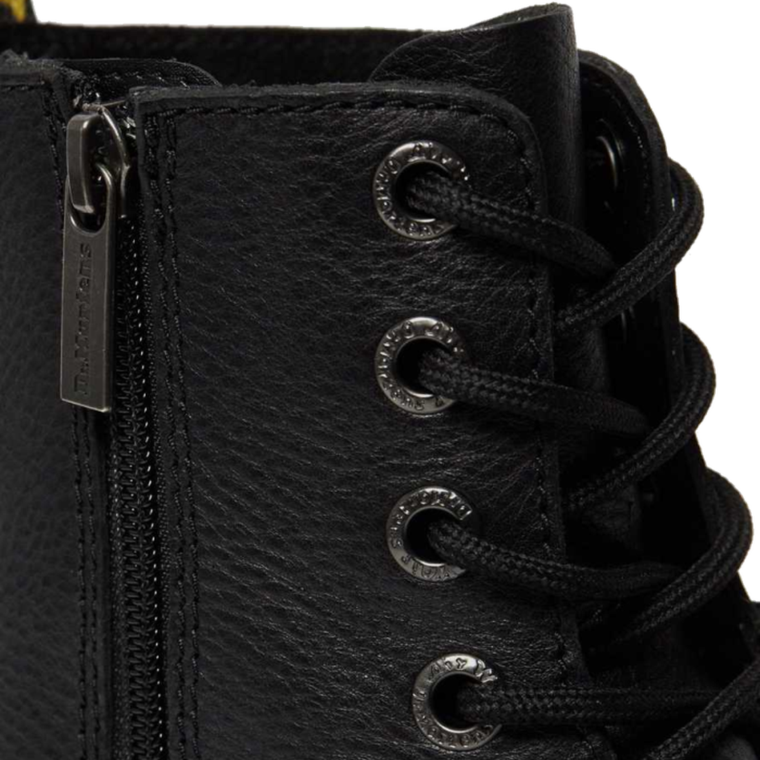 Close-up of the Dr. Martens Jadon III Pisa Black Chunky Boot, featuring textured black leather, black laces in metal eyelets, and a zipper with a pull tab engraved with Dr. Martens., 190665375770, 190665375787, 190665375794, 190665375817, 190665375824, 19