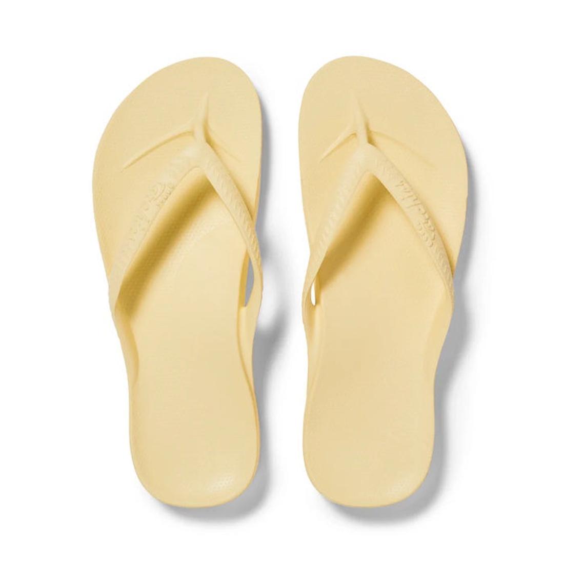 The Archies Footwear Arch Support Jandal in cheerful Lemon Yellow features comfy straps, a textured sole, and gentle arch support.  ksnz