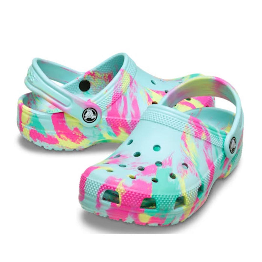 Crocs Kids - Marbled Clog Sandal Aqua Pink Youths feature a colorful marbled pattern in pastel blue, pink, yellow, and white with ventilation holes and a heel strap.