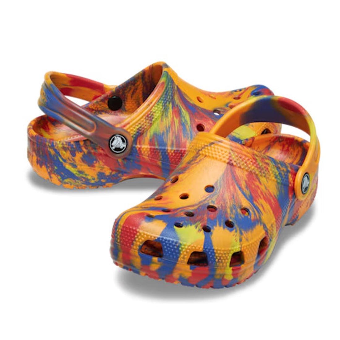 The Crocs Kids Toddlers - Classic Clog K Marbled Orange Zing Multi features a vibrant marbled design in orange, yellow, blue, and red with ventilation holes and supportive heel straps.