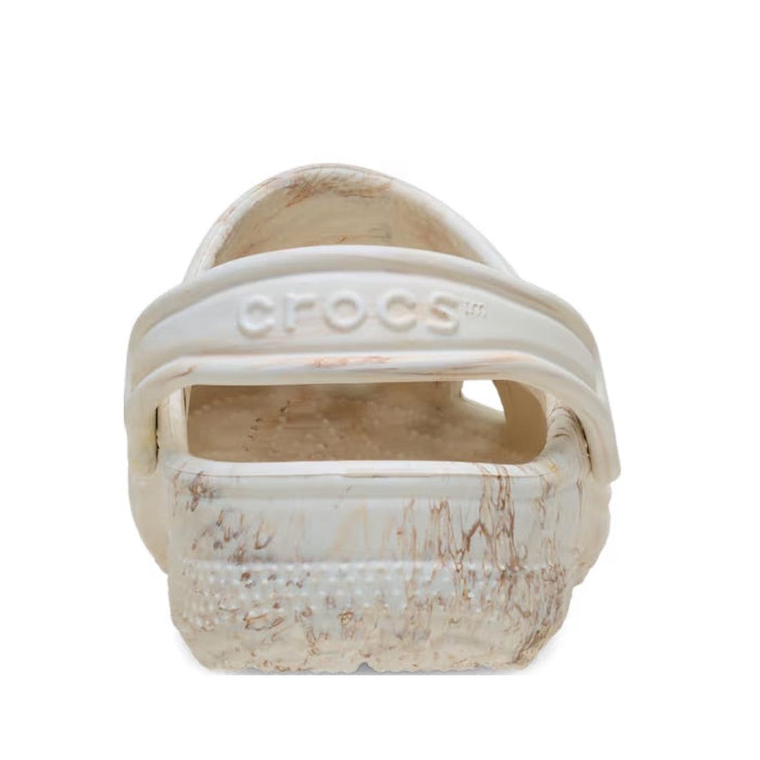 A rear view of the Crocs Kids - Watercoloured Marbled Clog Sandal Bone Swirl Youths shows its beige and brown marbled design, CROCS logo on the heel strap, textured sole, and lightweight Croslite foam for signature comfort., 198445279461, 198445279478, 19