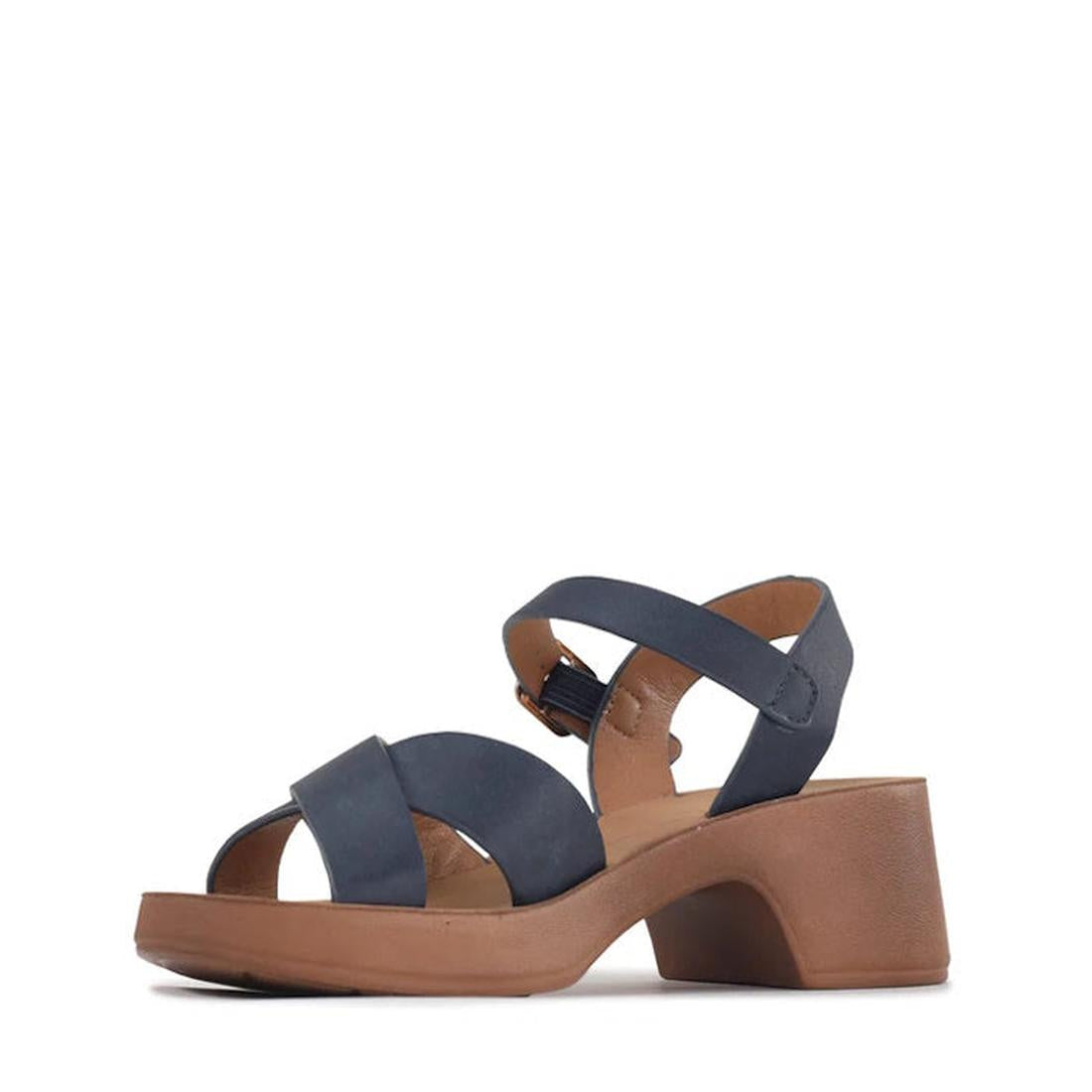 The Los Cabos Alegra Navy Wedge Platform Backstrap Sandal features double crisscross straps, a chunky tan heel, an ankle buckle strap, and a cloud-soft outsole for all-day comfort—displayed on a white background., 9321191292311, 9321191292328, 93211912923