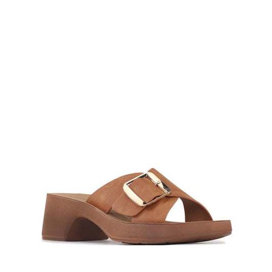 The Los Cabos Alegro Brandy Wedge Platform Women's Slide Sandal features a brown minimalist design with an open toe, medium block heel, and wide adjustable strap with a large gold buckle, shown on a plain white background.