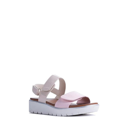 The Los Cabos Arica Pink Cream Summer Women's Sandal features a light pink toe strap, beige ankle back strap, and a white platform sole with a slight wedge for style and comfort. Shown against a plain white background.