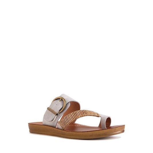The Los Cabos Bria Cloud Gray Light Flexible Sandal features a wide beige strap, large gold buckle, and rope detail—perfect summer footwear for any outfit, shown here as a single sandal on a white background.