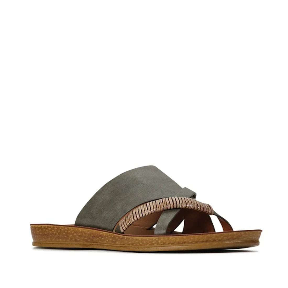 The Los Cabos Womens Bride Khaki Flat Slide Sandal features wide suede straps with a decorative woven bamboo-inspired accent and a brown textured flat sole, showcased in a side profile against a white background—an effortlessly chic choice for summer slid