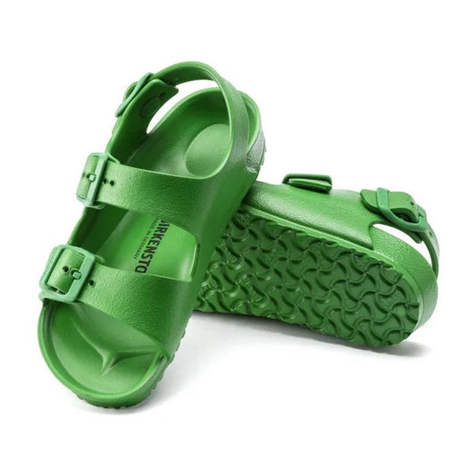 The Birkenstocks Kids Fern Green Milano EVA Sandal in narrow width features bright green waterproof construction, adjustable buckle straps, and textured soles—combining style and practicality for kids.