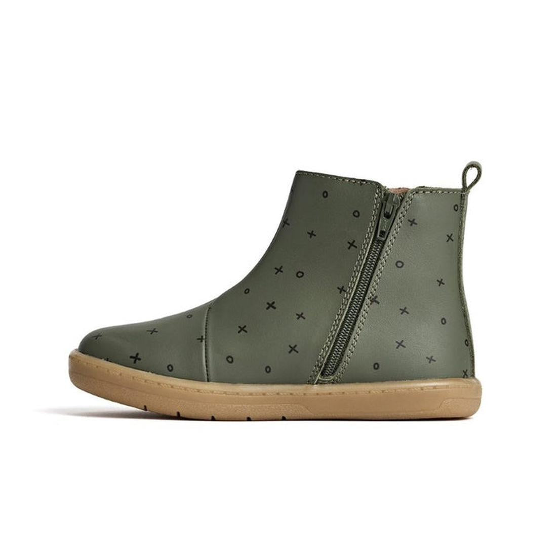 The Pretty Brave Electric Boot Khaki XO for kids features olive green leather, a tan rubber sole, side zipper, small black X and O patterns, and a subtle lightning bolt design—all shown in profile against a white background., 28805, 28806, 9420075305335, 