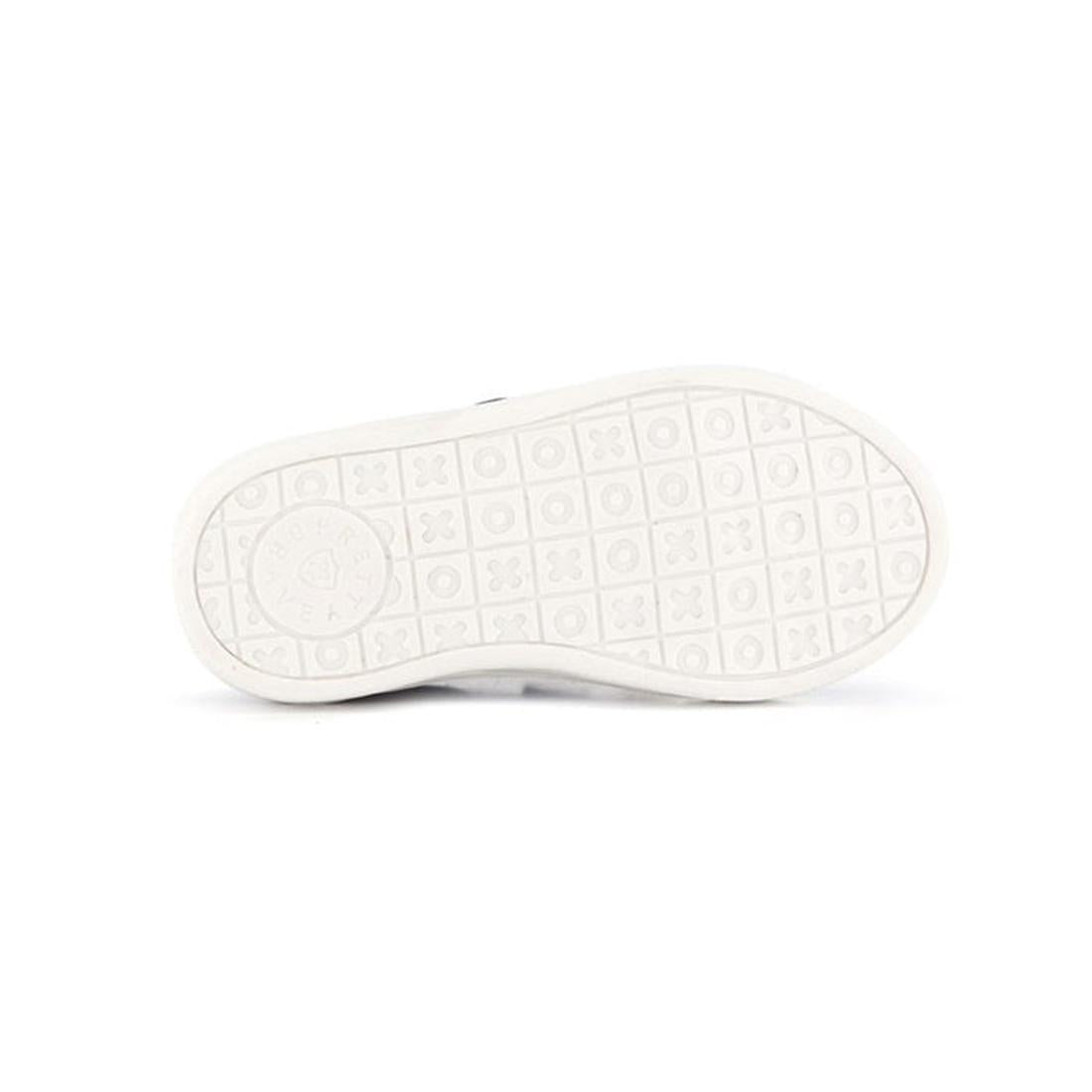 The Pretty Brave XO Trainer Blush kids shoe is shown from the bottom, revealing a textured white sole with a circular logo near the heel and grid pattern with small symbols. The background is plain and white., 28764, 9420075304024, 9420075304031, 94200753