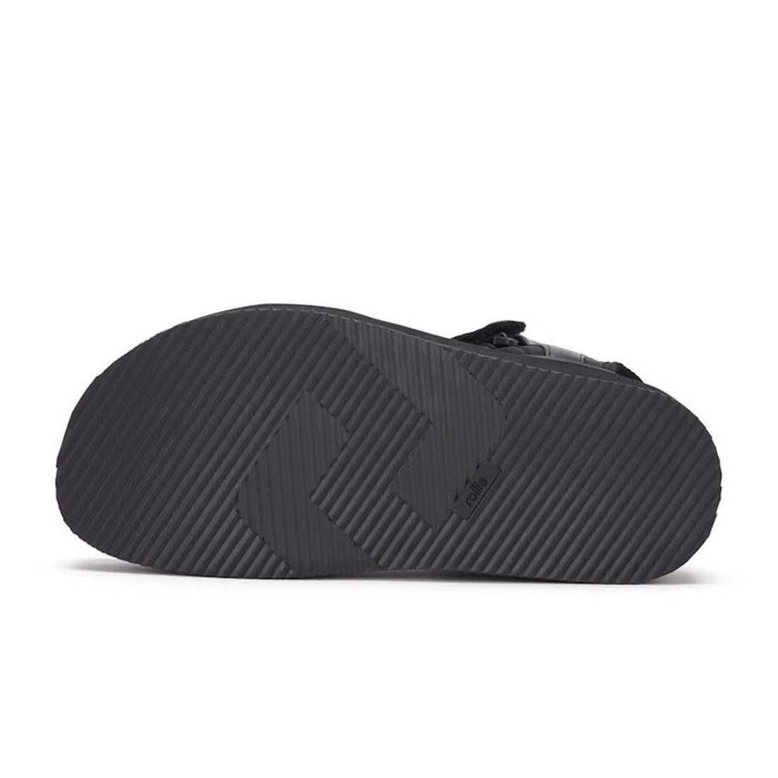 The image shows the bottom view of the Rollie Womens Ace Sandal All Black Leather, featuring a comfortable design and a textured rubber sole with diagonal grooves and an embossed geometric pattern., 9339554333878, 9339554333885, 9339554333892, 93395543339
