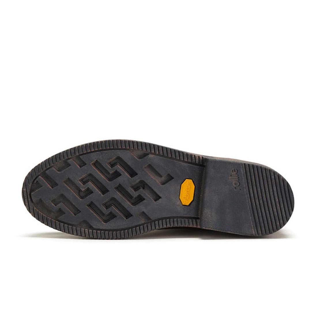 The image shows the black Vibram outsole of the Rollie Womens Chelsea Rise Vintage Mocha Leather Boot, featuring a patterned tread, yellow Vibram logo, and horizontal grooves at the heel., 9339554341682, 9339554341699, 9339554341705, 9339554341712, 933955