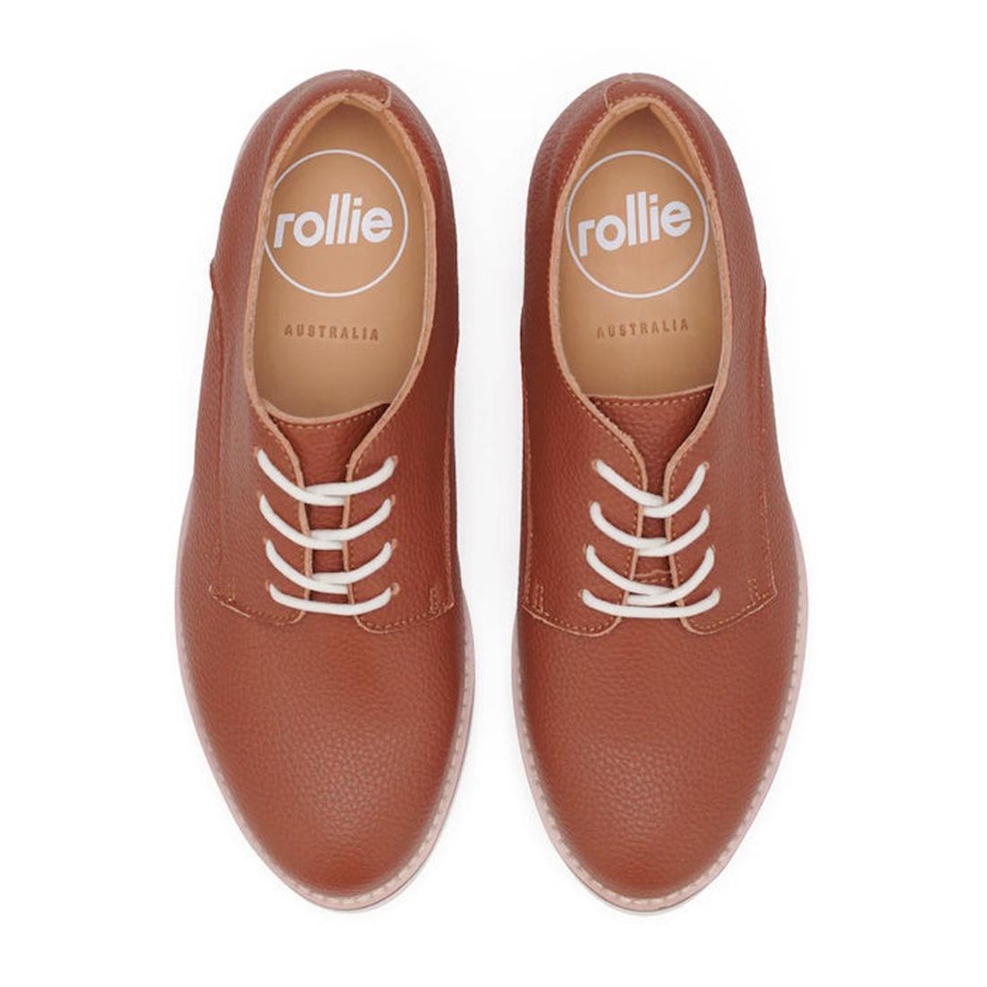 Top down pair of Rollie Derby Cognac brown leather shoes with white laces on a white background, featuring the 'rollie' brand.
9781760789831,
9781760789848,
9781760789855,
9781760789862,
9781760789879,
9781760789886,, 9781760789831, 9781760789848, 9781760