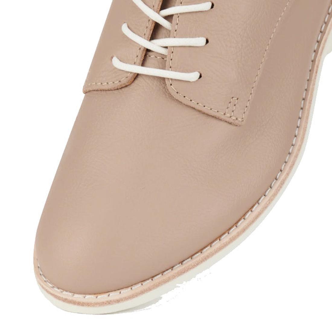 Close-up of the front part of the Rollie Womens Derby Super Soft Clay Leather Shoe in beige, featuring white laces and visible stitching along the edge of the sole., 9781760781552, 9781760781576, 9781760781507, 52452, 52453, 52454