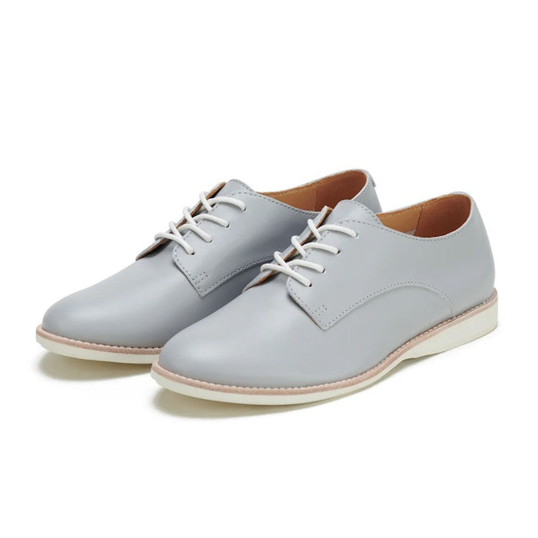 The Rollie Womens Derby Super Soft Stone Leather Shoe features light gray premium leather, white laces, and white soles for sneaker-like comfort, shown here on a white background., 9781760763930, 9781760763947, 9781760763954, 9781760763961, 9781760763978