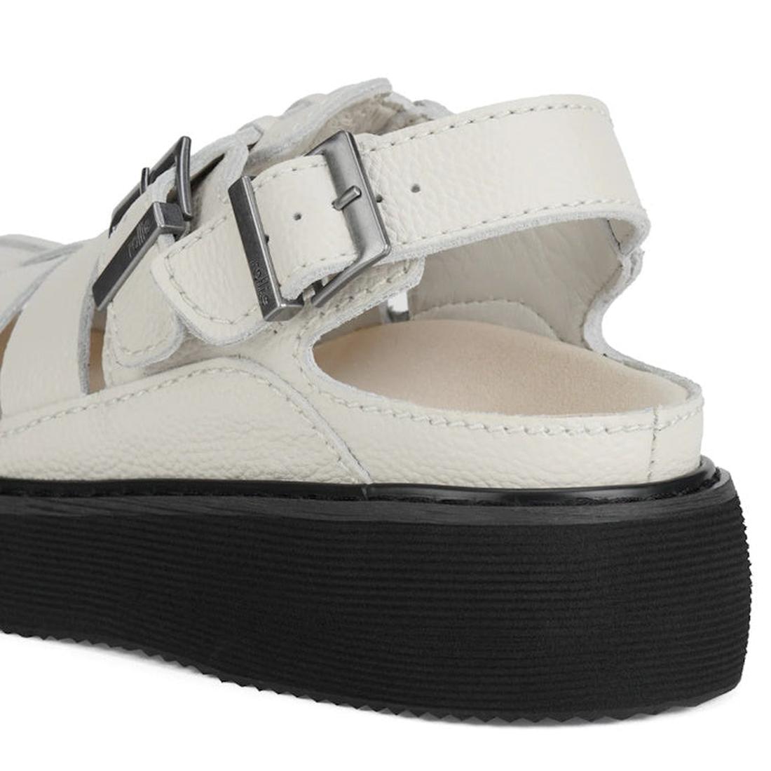 Left foot heel detail of the Rollie Hyde Fisherman sandla in Bone showing the buckle on the heel strap and the bucklle on the top strap around the ankle with black sole on a white background.,
9781760788933,
9781760788940,
9781760788957,
9781760788964,
97