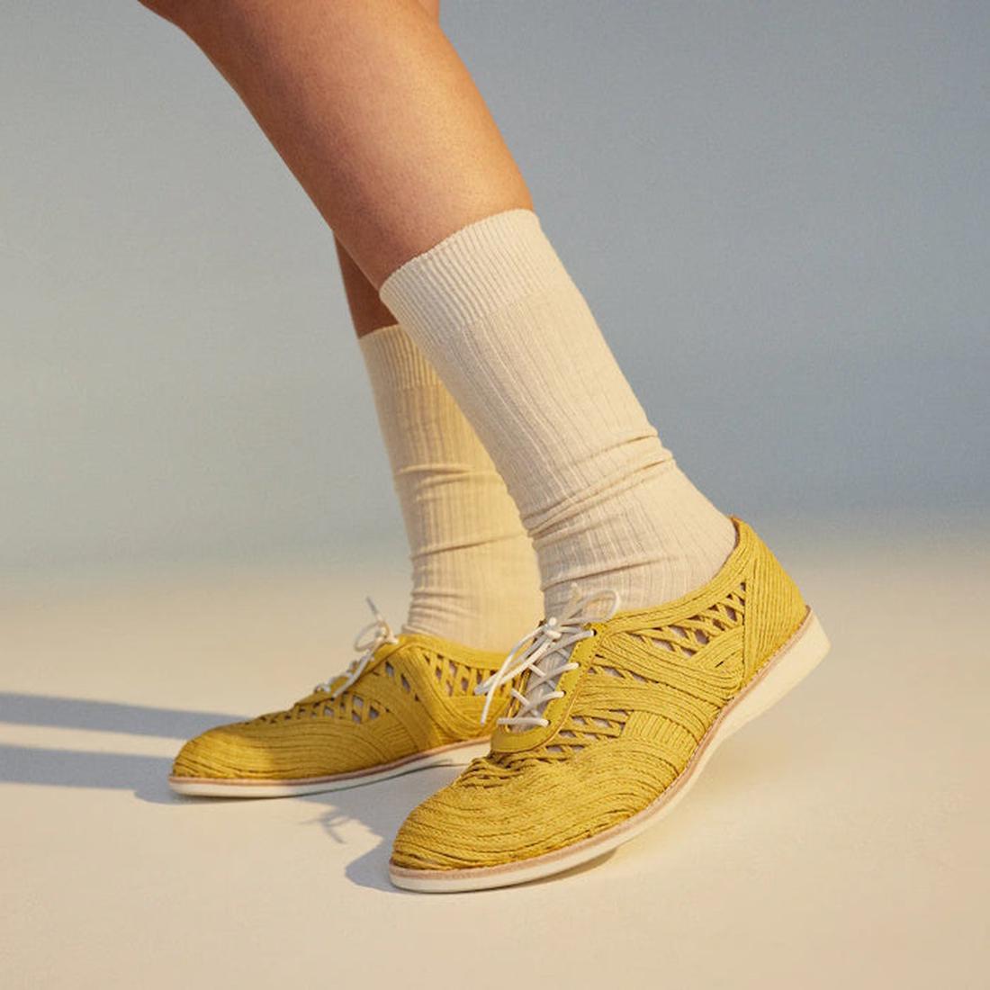 Rollie Womens Derby Open Weave Trainers in sunny yellow, with comfy woven lace-up design, lightweight EVA soles, and cream socks shown.  ksnz, 9781760774691, 9781760774707, 9781760774714, 9781760774721, 9781760774738