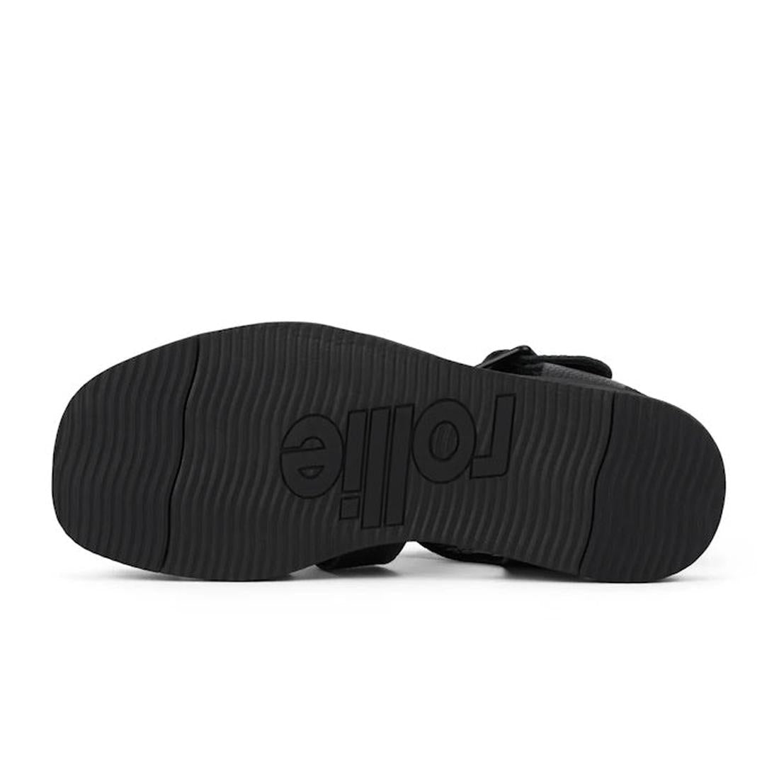 Black sandal sole of the Rollie Fisherman sandal with 'Folie' branding on a white background.,
9781760777722,
9781760777739,
9781760777746,
9781760777753,
9781760777760,
9781760777777,, 9781760777722, 9781760777739, 9781760777746, 9781760777753, 978176077