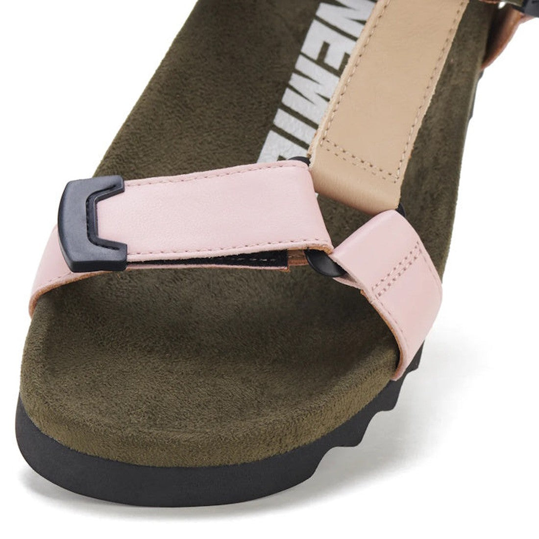 Close-up of the Rollie Womens Sandal Tooth Wedge Blush Camo, featuring adjustable sheep leather straps in light pink and tan, an olive green suede footbed, black buckle on the front strap, and a black EVA sawtooth wedge outsole., 9339554326726, 9339554326
