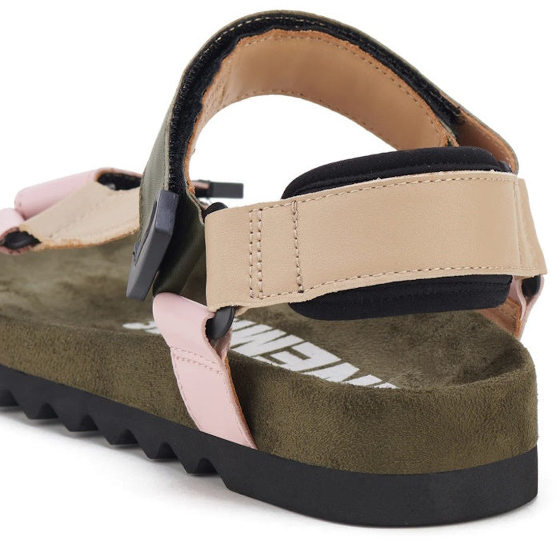 A close-up of the Rollie Womens Sandal Tooth Wedge Blush Camo, featuring beige and pink adjustable sheep leather straps, a black buckle, olive green footbed, and a black EVA sawtooth wedge outsole., 9339554326726, 9339554326733, 9339554326740, 93395543267