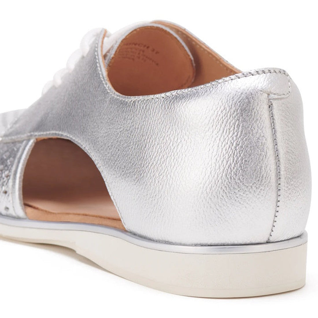 Close-up of the heel and side of the Rollie Womens Sidecut Punch Silver Metallic Leather Shoe, featuring a white anti-slip rubber outsole, side cutout, and tan interior lining., 9339554231341, 9339554231358, 9339554231365, 9339554231372, 9339554231389