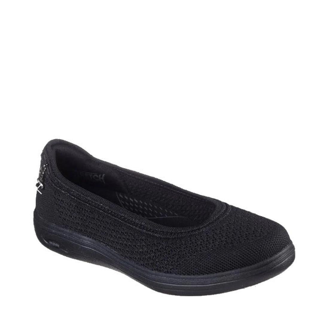 The Skechers Arch Fit Inspire Refined Black Ballet Flat features a breathable mesh upper, cushioned insole, and slightly raised sole, shown on a white background.