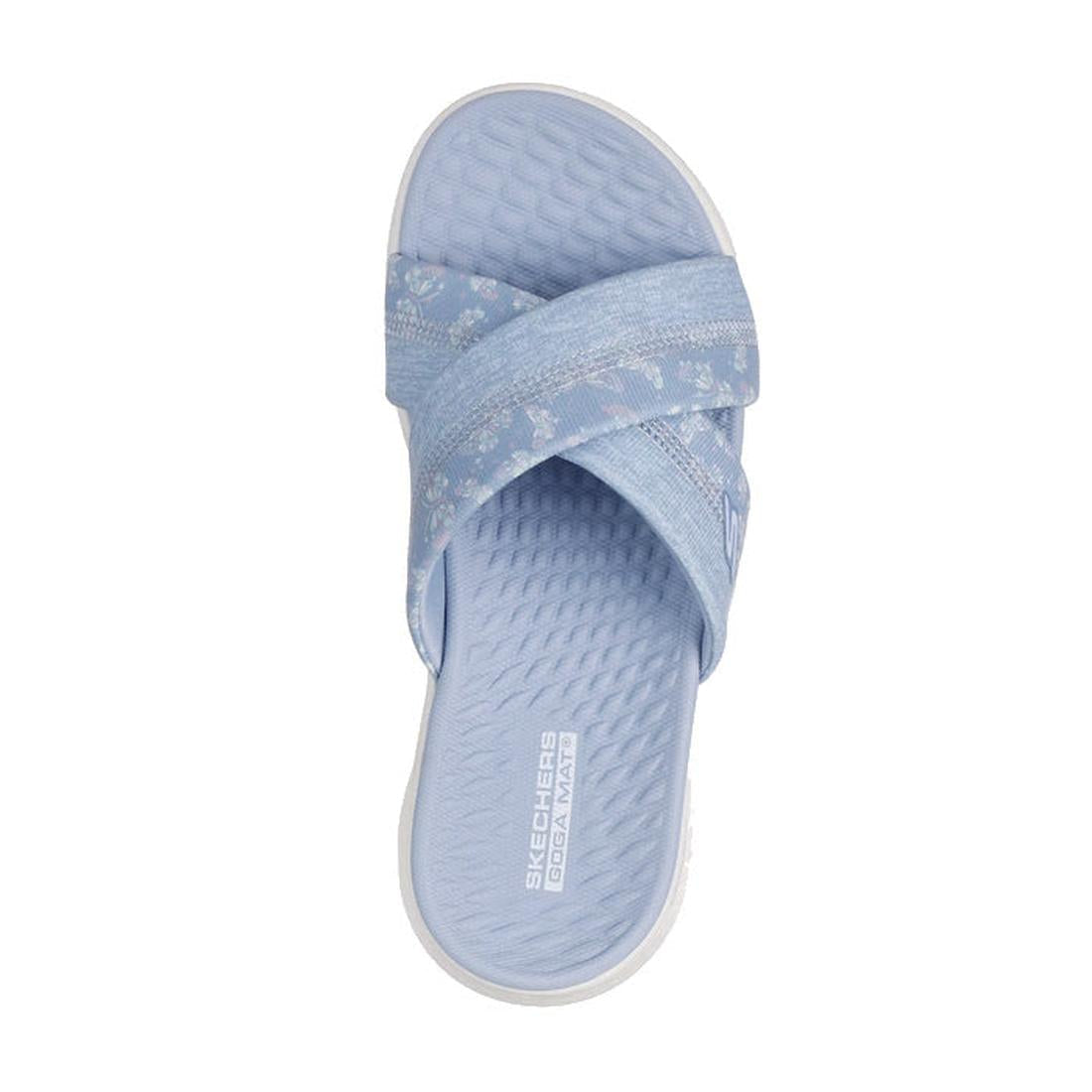 A single Skechers Go Walk Flex Women's Sandal Slide Butterfly Bliss in periwinkle, featuring textured crisscross straps and a cushioned Goga Mat footbed with visible branding near the heel, viewed from above., 47970, 47971, 199025957625, 199025957632, 199