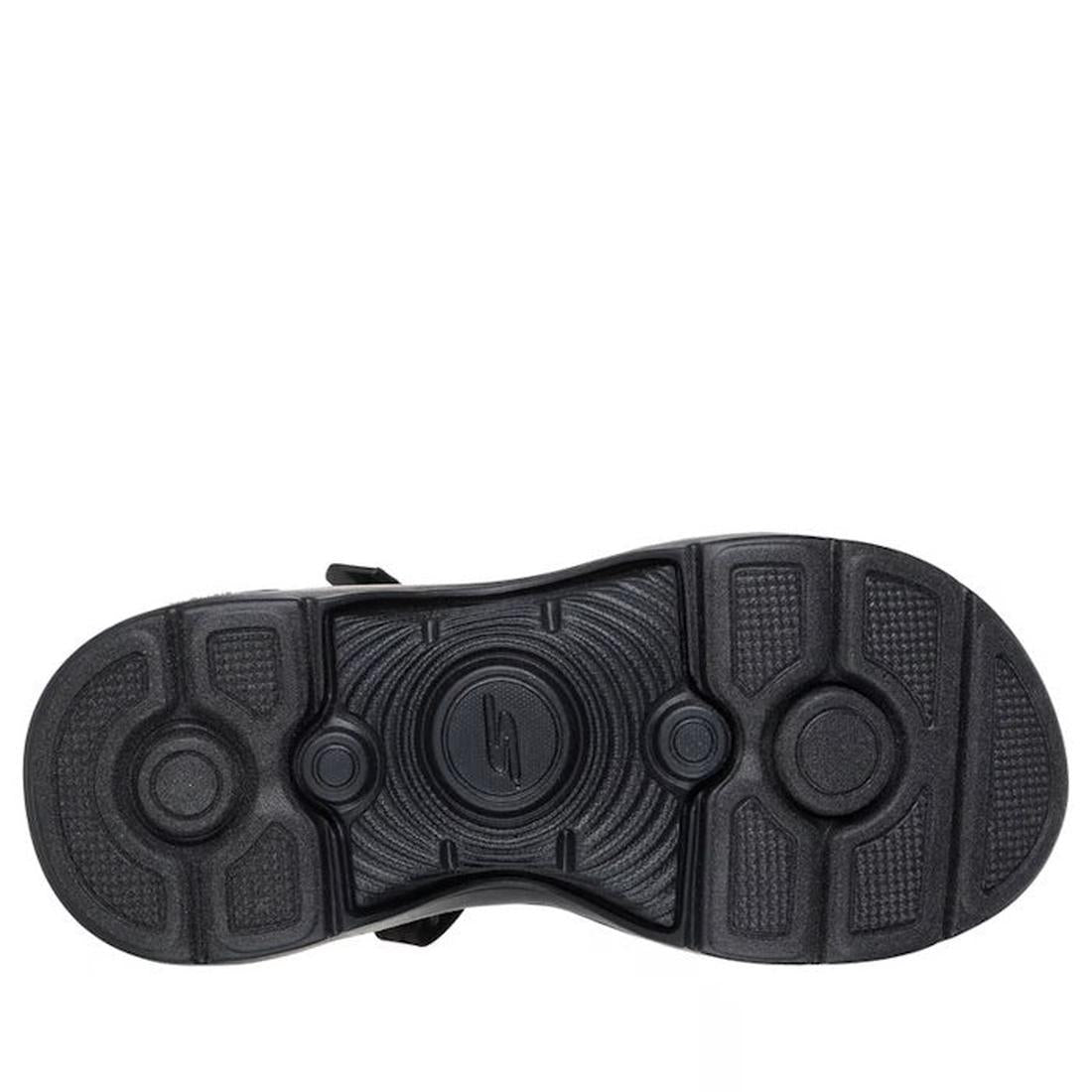 The image shows the black rubber sole of the Skechers Womens Go Walk Arch Fit 2.0 SLIP IN Candace Black Sandal, viewed from below, with circular patterns, textured areas, and a central logo., 49057, 198739235920, 198739235937, 198739235944, 198739235951, 