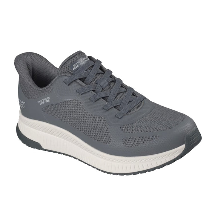 The Skechers Mens Bobs Sport Squad Chaos 4 Slip In Charcoal Grey features a gray mesh and synthetic upper, white sole, cushioned heel, Memory Foam insole for comfort, easy slip-in design, and subtle side and tongue branding.