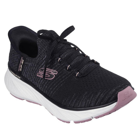 The Skechers Slip In Edgeride Impression Black Pink Trainer is a black vegan sneaker with a white sole, light pink accents, breathable mesh upper, Air-Cooled Memory Foam for comfort, slip-in design, and logo on the side.