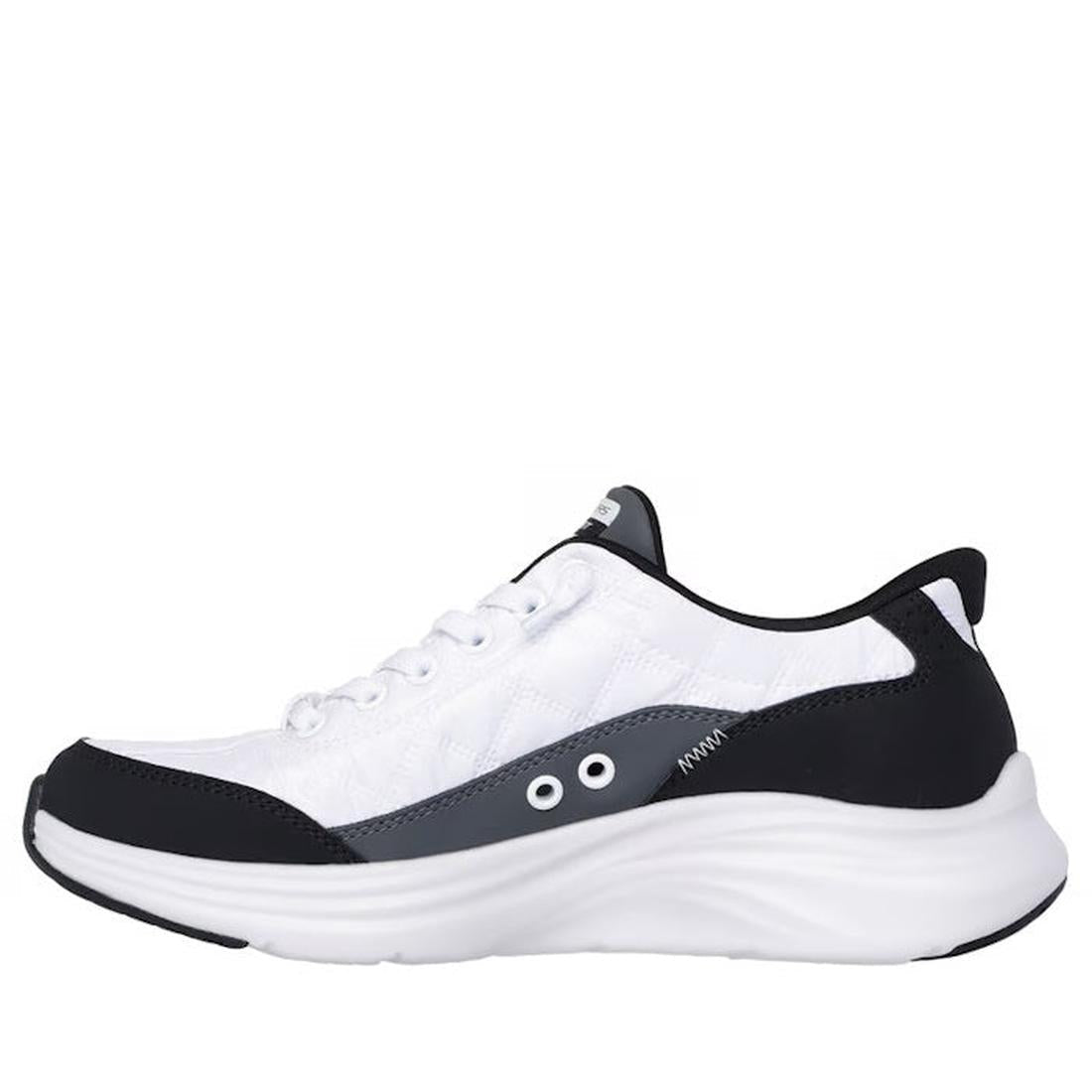 The Skechers Womens Slip In Contour Foam Cozy Fit Trainers in white and black feature gray accents, a lace-up front, side ventilation holes, a thick wavy sole with Air-Cooled Memory Foam, shown from a side profile on a plain background., 197976962033, 197