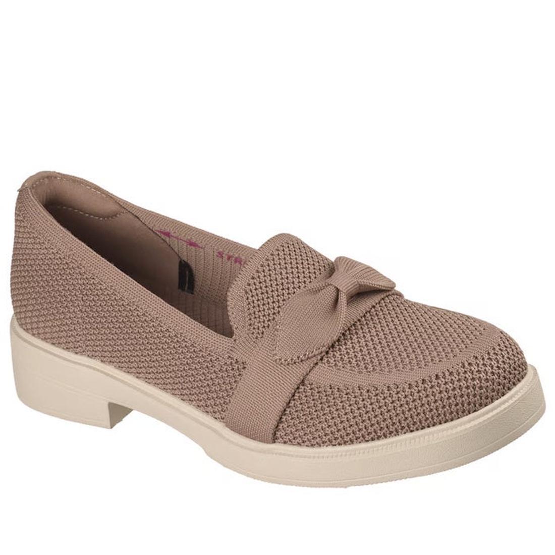 The Skechers Womens Cleo Taylor Desire Mocha Fabric Loafer is a light brown vegan slip-on with a textured knit upper, decorative bow, thick off-white rubber sole, and cushy memory foam insole for all-day comfort.