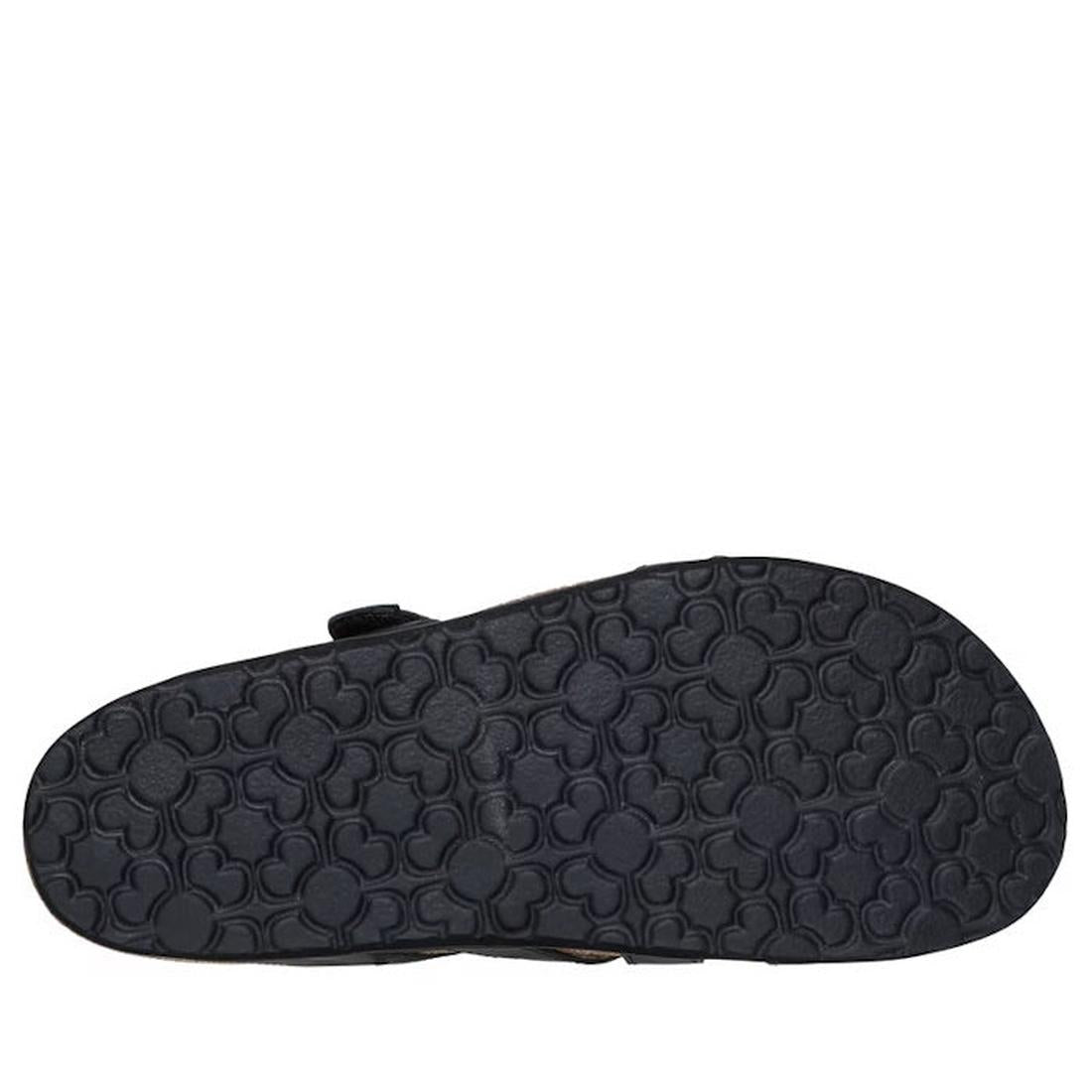 The image shows the bottom sole of the Skechers Womens Arch Fit Granola Slim Black Slide, featuring a dark rubber texture with a repeating Mickey Mouse-shaped pattern, designed to complement its leather upper., 49036, 198739182132, 198739182149, 198739182