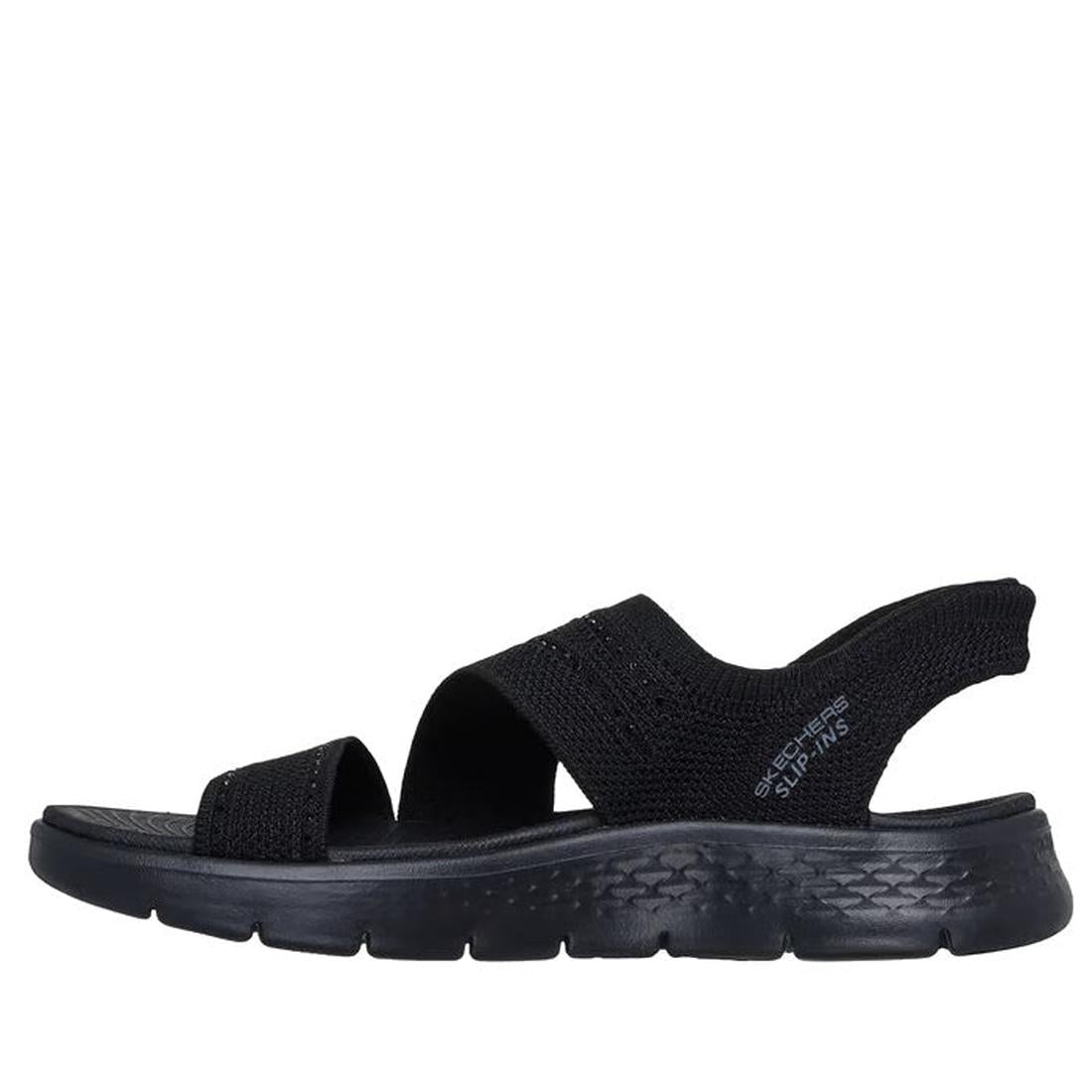 The Skechers Womens Slip Ins Sandals Go Walk Flex Belle Black is a vegan, black slip-on sandal with a thick textured sole and two wide fabric straps, offering a sporty, casual design ideal for everyday wear., 48126, 48127, 198376904326, 48129, 19837690433