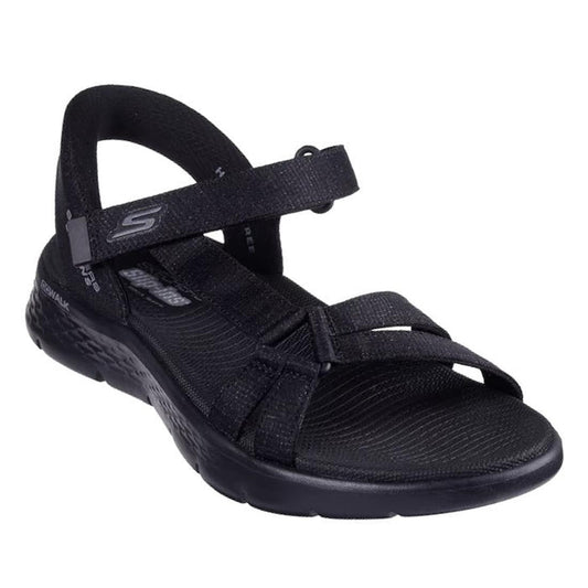 Black Skechers slip in Illuminate sandal with rigid heel but padded heel strap that allows the foot to slip in. Velcro adjustable strap over the top of the foot, thin strap on the outer foot that attachs to the double straps over the toe  white sole on a 