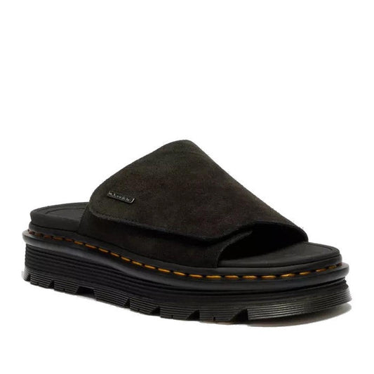 The Dr Martens Zebzag Black EH Suede Slide Sandal features a thick, ridged air-cushioned sole, visible yellow stitching, an open toe design, and a small metallic brand tag on the upper strap.