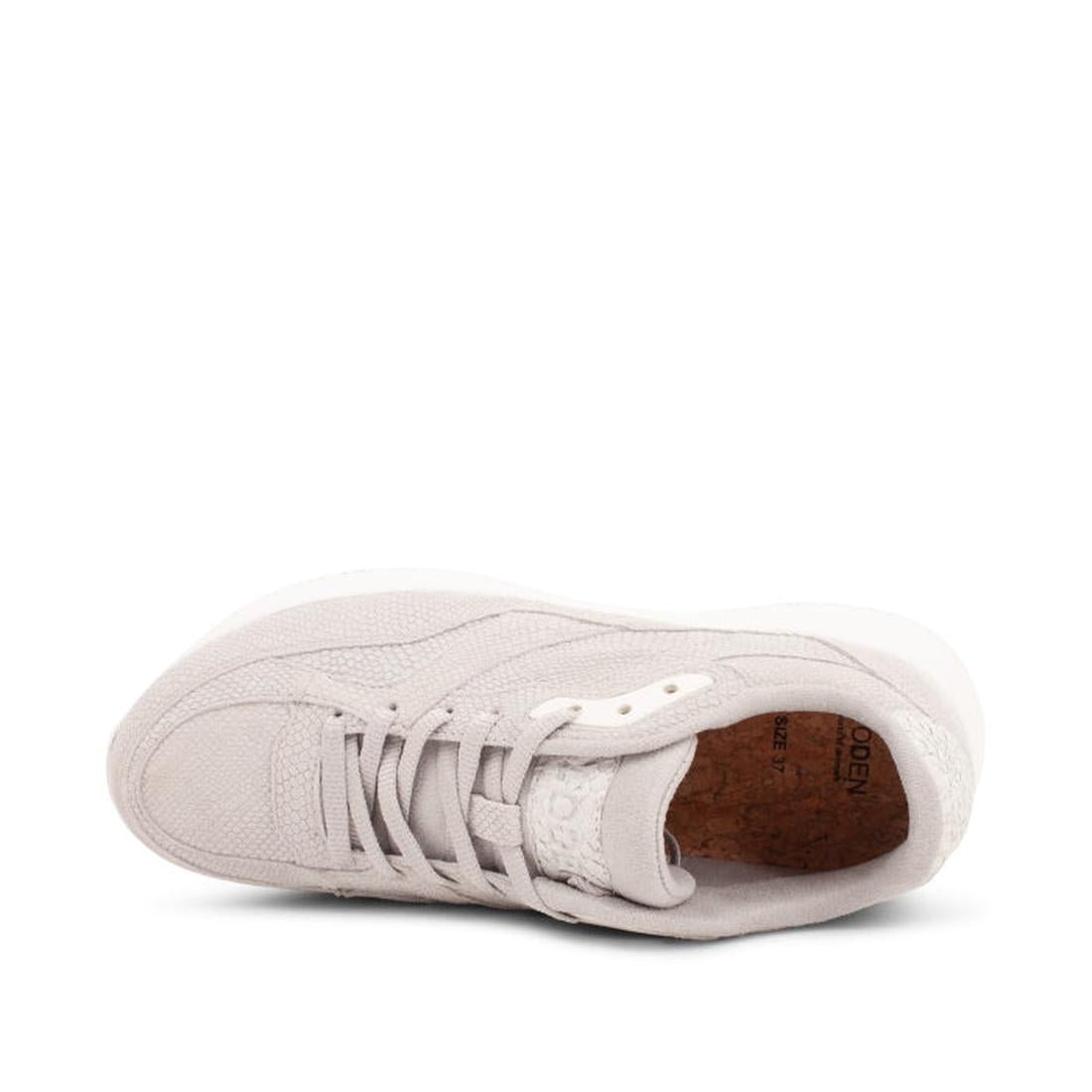 A top view of the Woden - Sophie Snake Suede sneaker in Sea Fog Grey, featuring textured fabric, white laces, a shock-absorbing cork insole, rounded toe, visible upper stitching, and Scandinavian minimalist style., 5713326155754, 5713326155761, 5713326155
