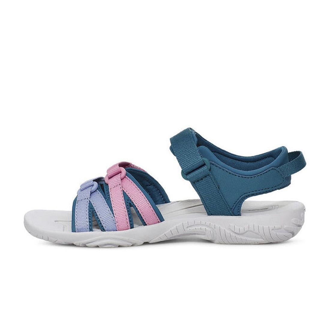 The Teva Girls Active Sandal K Tirra in Blue Coral Multi features a white sole, blue ankle strap, three front straps in blue, purple, and pink tones, and is made from quick-dry webbing for comfort and durability. Shown in side profile on a white backgroun