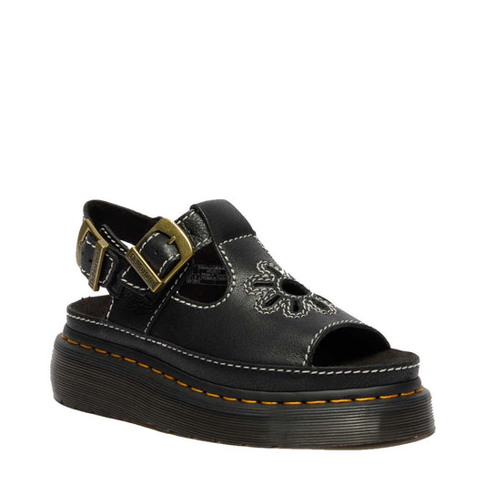 Dr Martens Dunnet Flower Womens Sandal in black with a chunky sole, floral details, open toe, gold buckle strap, and yellow trim.  ksnz