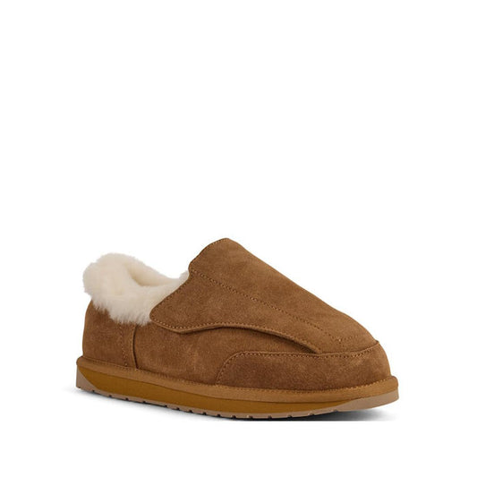 The EMU FlexiCare Wide Opening Sheepskin Slippers in Chestnut feature plush white fleece lining, a sturdy rubber sole, and an easy open design. Photographed against a plain white background.