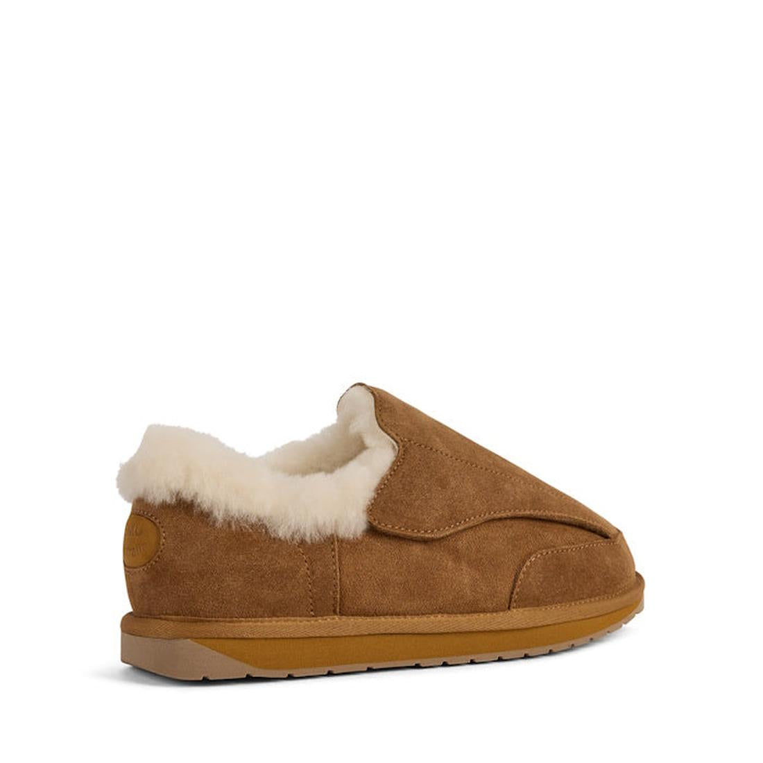 The EMU FlexiCare Wide Opening Sheepskin Slippers in chestnut feature a rubber sole and soft white faux fur lining, shown in side profile against a white background—ideal for anyone wanting the comfort of sheepskin slippers., 9330071990957, 9330071990964,