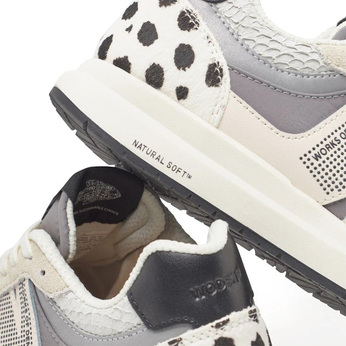 Close-up of Woden Rigmor Animal Damlation Lace Up Sneakers in grey, cream, and white, featuring black and white cow-print details. Made with LWG certified leather and a WODEN Natural Soft midsole for added comfort., 5713326695267, 5713326695274, 571332669