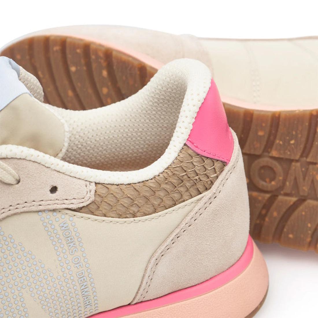 Close-up of the Woden Ronja Ivory Blush Lace Up Sneaker featuring beige leather, a textured brown heel, pink back accent, light blue side panel, cork insole, and a gum sole with tread pattern and partial "WORKS" embossing., 50265, 5713326700633, 571332670