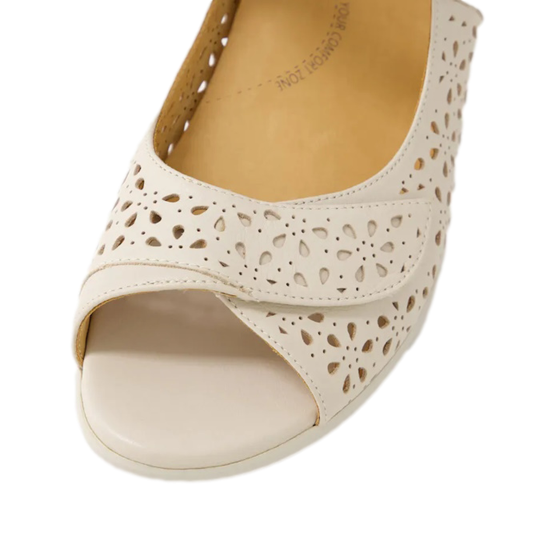 Close-up of the Ziera Daffodil W Women's Almond Off White Leather Sandal featuring a floral cutout pattern, low wedge heel, cushioned insole, and rounded toe for comfort—perfect for summer wear., 49093, 49094, 9351017754167, 9351017754174, 9351017754181, 