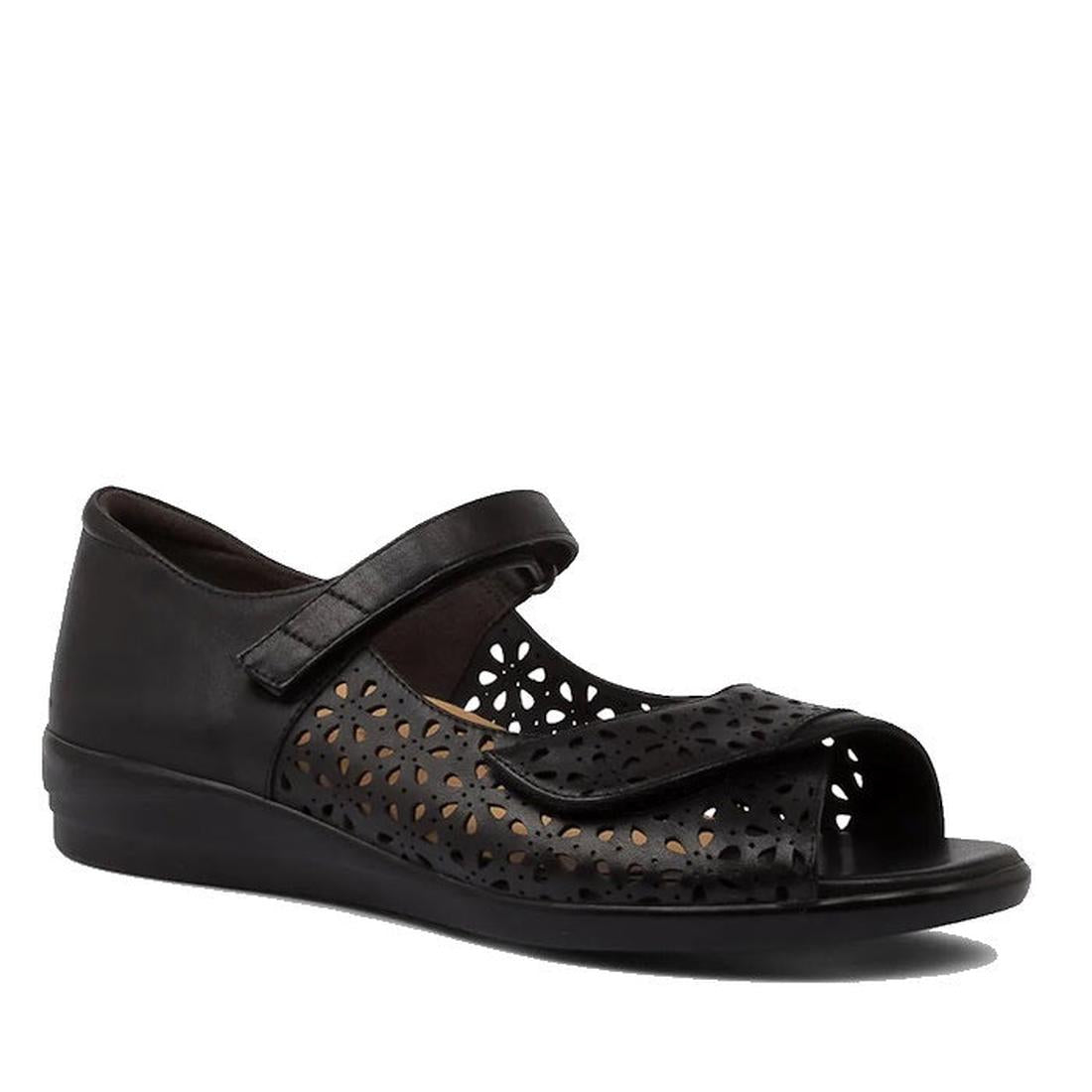 The Ziera Daffodil W Women’s Black Leather Sandal features a low wedge heel, open toe, decorative cut-out floral patterns, two adjustable hook-and-loop straps, and high arch support for all-day comfort.